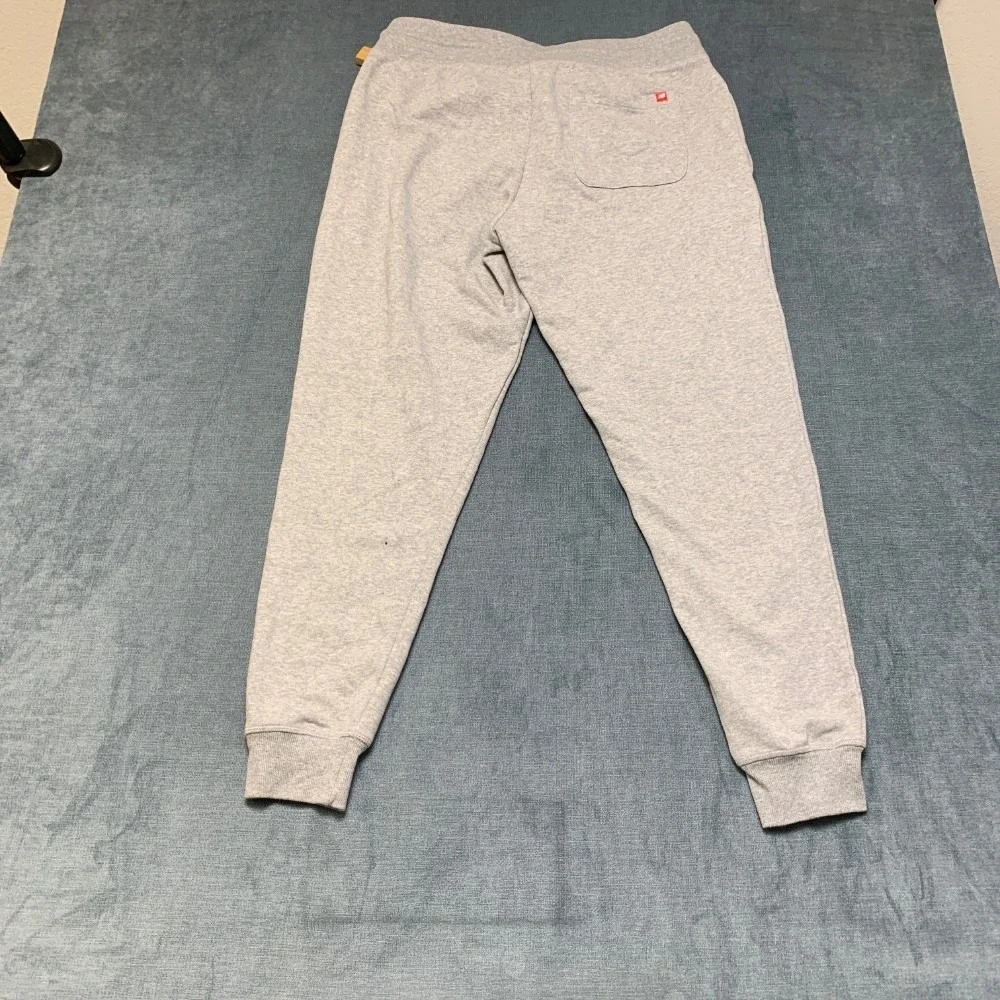 New Balance Jogger Pants Men Large Heather Gray Wordmark Logo Drawstring Tapered